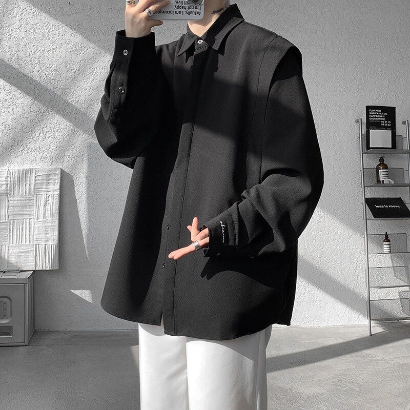 Two shoulder padded long sleeved shirts