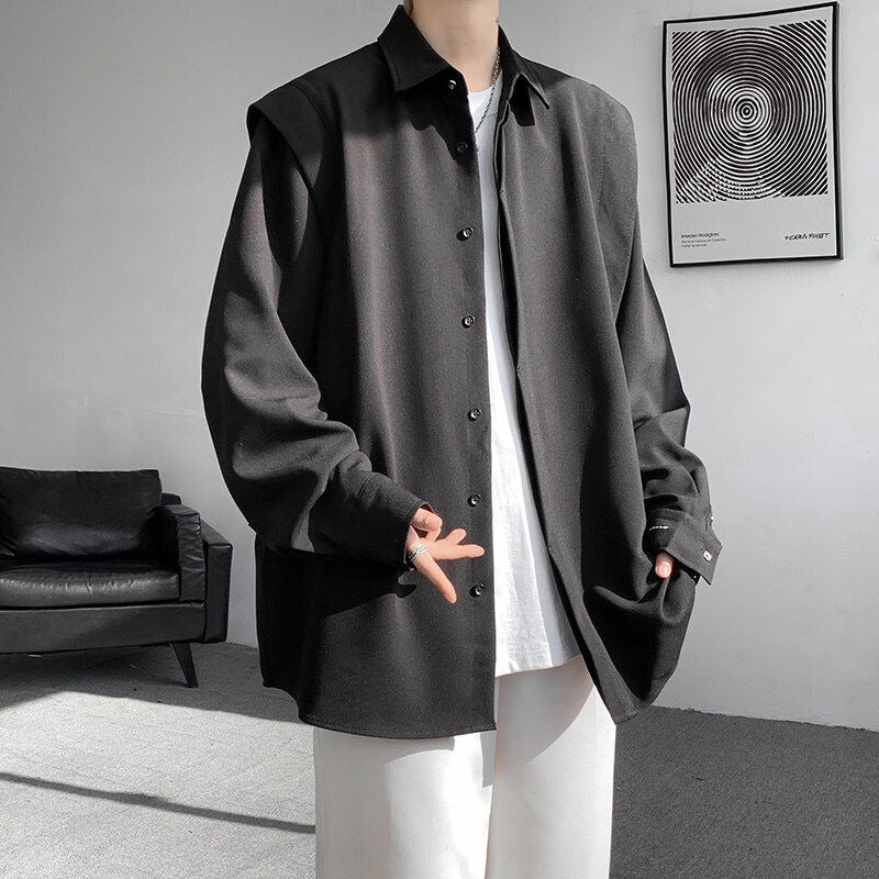 Two shoulder padded long sleeved shirts