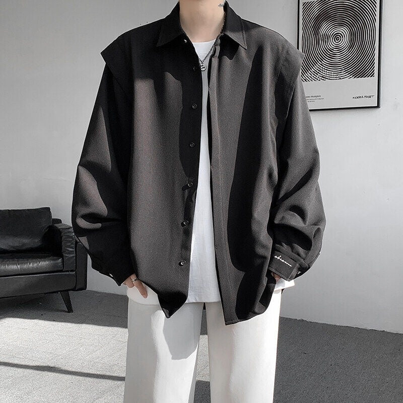 Two shoulder padded long sleeved shirts